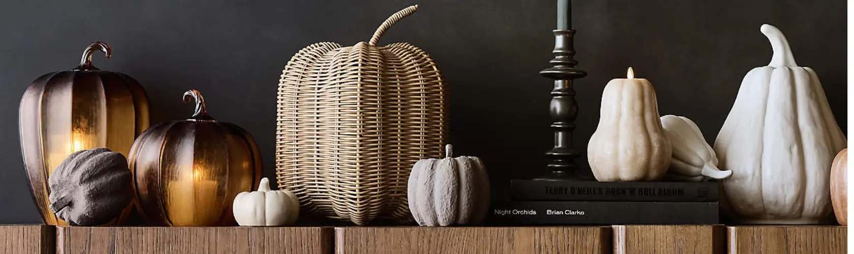 Pumpkins lined up on a table.