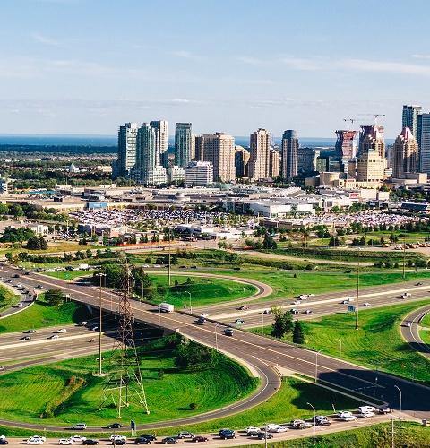 City skyline with a major roadway showing clear directions and easy access to the shopping centre
