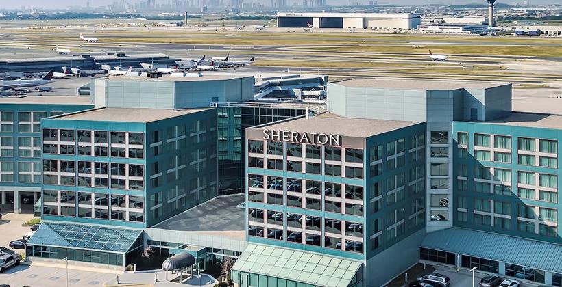 Sheraton Gateway Hotel exterior near the airport highlighting a partnership for visitor stays