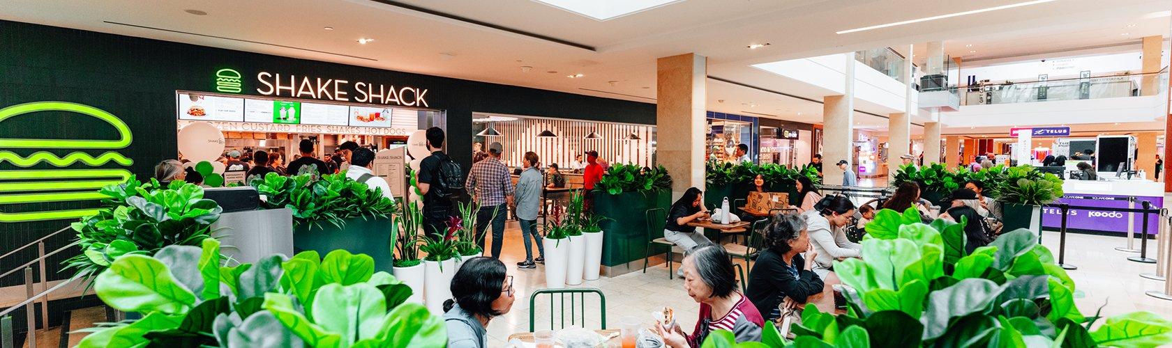 Dining space with guests enjoying meals in a lively and social restaurant setting