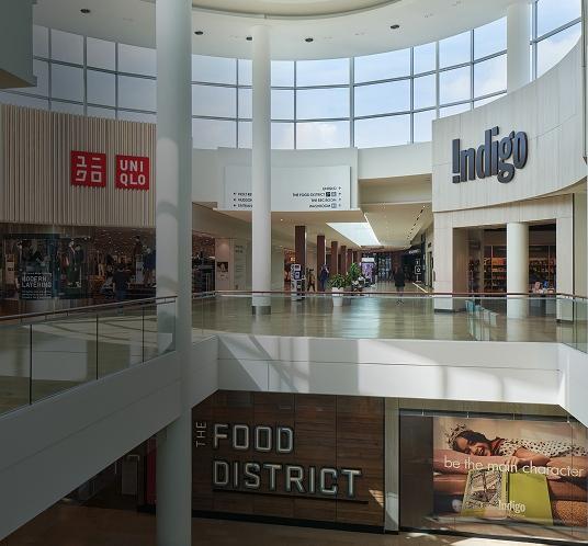 Mall interior with Indigo storefront along a spacious and well-lit shopping walkway