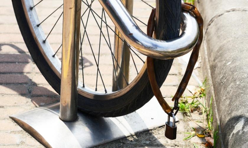 Bicycle secured at a designated rack promoting eco-friendly and convenient travel options