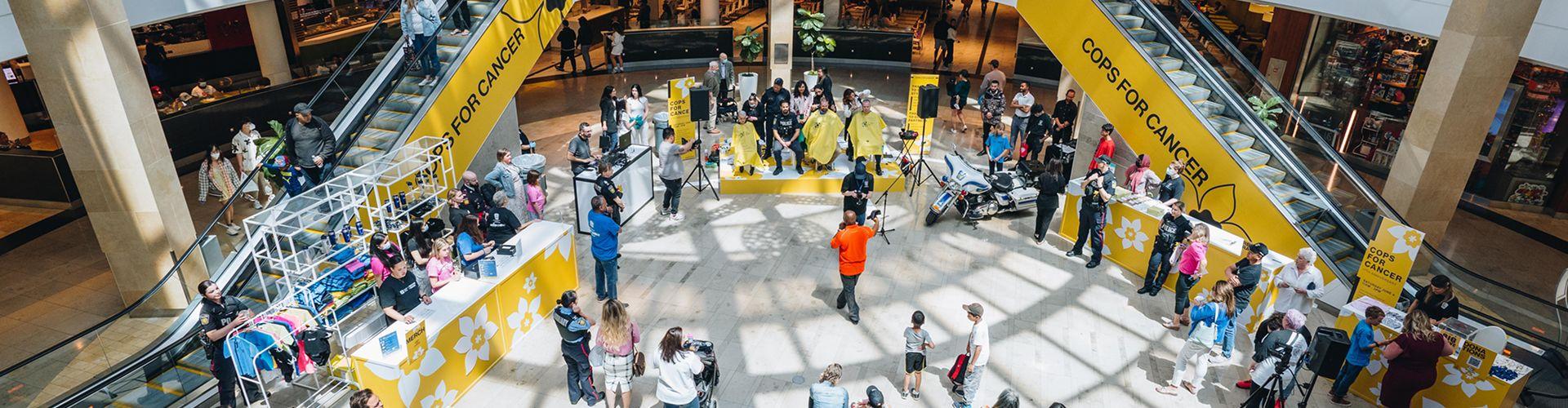 Community event at the shopping centre with visitors engaging in a live charity activation
