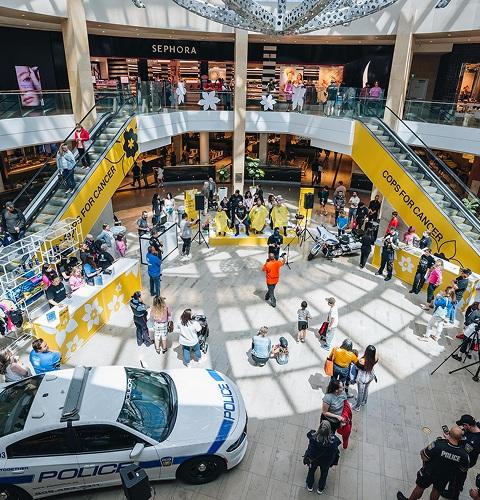 Community event at the shopping centre with visitors engaging in a live charity activation